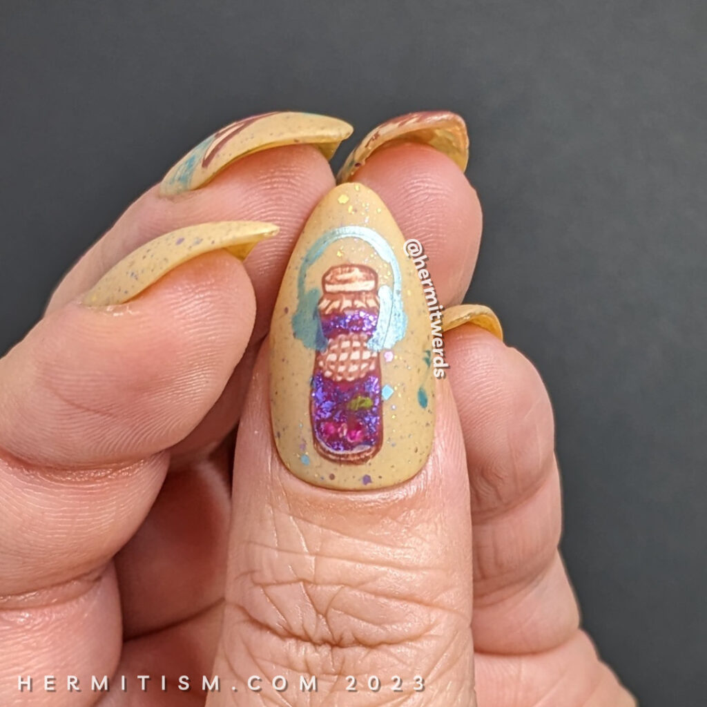 A toasty nail design that combines stamping decals of jamming out to rock music and jam on toast for January.