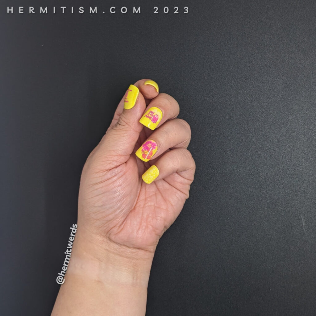 A bright yellow hibiscus and pineapple nail art with a "sexy" censored pineapple stamping decal to make it tropically funny.