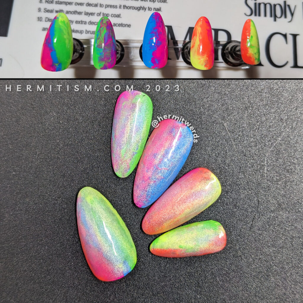 A rainbow neon smoosh marble nail art with a holographic magnetic nail polish painted on top.