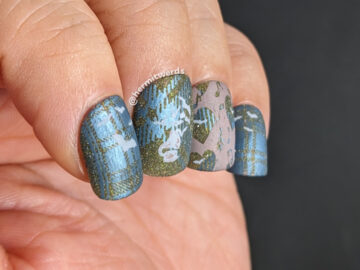 A batty nail art with a background of blue plaid stamped over olive reflective glitter and music and bat stamping decals.