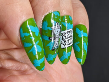 Scarecrow nail art with a bright blue & green background of flapping crows with cute black and white scarecrows stamped on top.