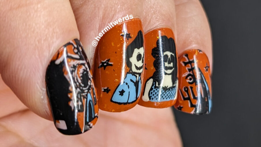 A vintage Halloween poster nail art design with rockabilly skeletons and stylized haunted houses in orange, black, grey-blue, and cream.