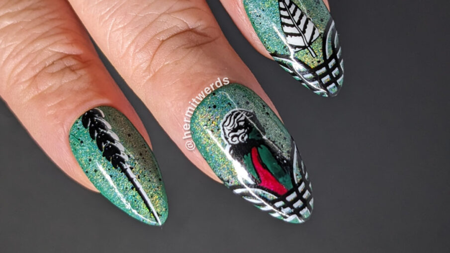 An art deco Christmas nail art w/a green magnetic holo background and nail stamped art deco lady, Christmas tree, and framing flourishes.